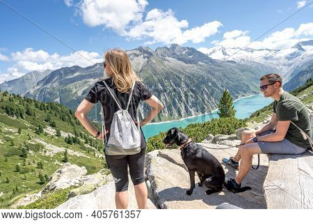 Zillertal, Austria - Aug 7, 2020: Hikers Take A Rest On Trekking Way To Olpererhutte