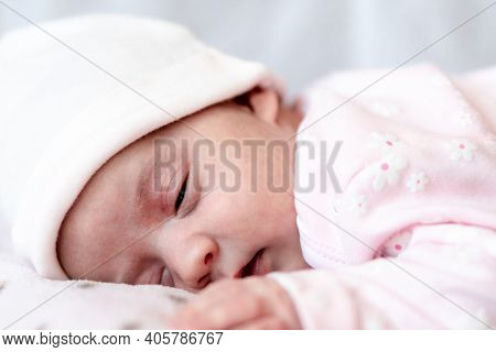 Childhood, Care, Motherhood, Health Concepts - Close Up Little Peace Calm Newborn Baby Girl In Pink 