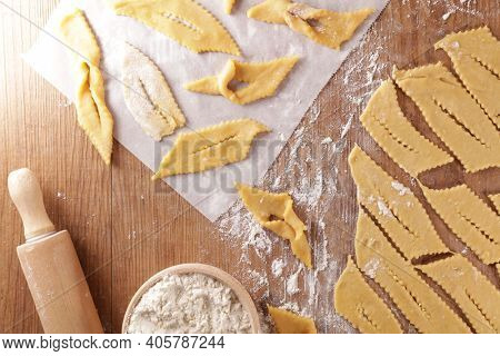 cooking traditional bugne on wood background