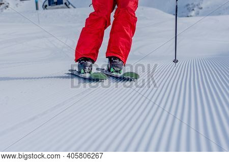 Close-up Shot Of Skier On Snow Lines.