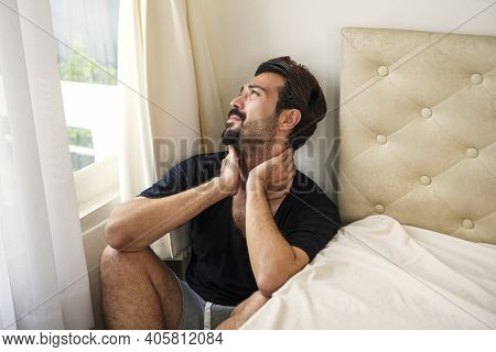 Despair Young Man Sitting Alone In Bedroom While Overthinking About Overwhelmed Problem. Sad Male Cr