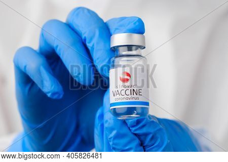Sinovac Coronavirus Vaccine In Doctors Or Nurses Hands In Blue Rubber Gloves. Prevention Of Sars-cov