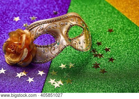 Festive, Colorful Mardi Gras Or Carnivale Mask On Golden, Green And Purple Background. Venetian Mask