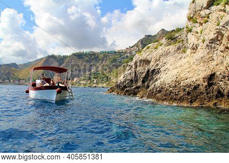 Blue Sea Water, Rocks, A Cave Carved In The Rock, A Cave In The Rocks By The Sea, A Blue Cave In Sic
