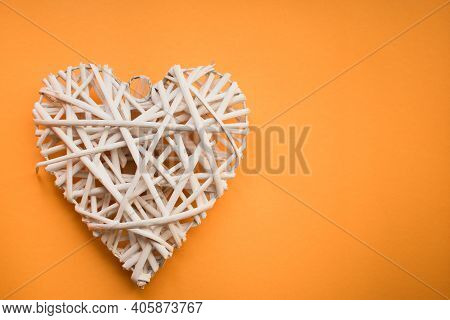 Wooden Heart On Yellow Background For Valentine's Day. Flat Lay, Top View, Copy Space. Valentine's D