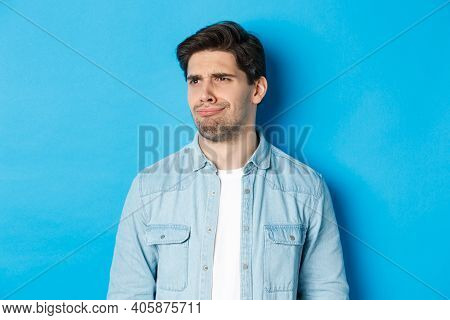 Close-up Of Upset And Disappointed Man Grimacing, Looking Dissatisfied Left, Cringe From Bad Promo B