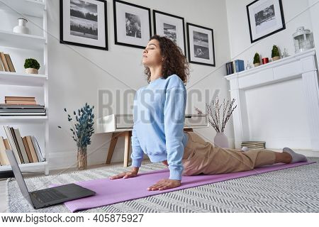 Fit Young Woman Doing Yoga Exercise Watching Tv Yoga Class Learning Position With Fitness Tutorial O
