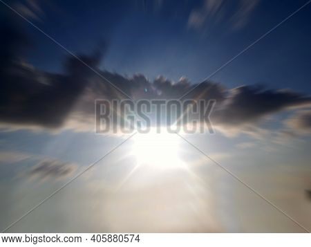 Blue Sky With Sun Light And Rushing Clouds Background. Inspirational Backgrounds With Copy Space.