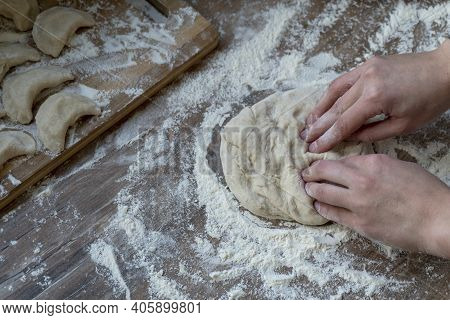Process Of Kneading Doung With Fingers Of Female Hands, Flour, Vareniki, Traditional Russian Dish At