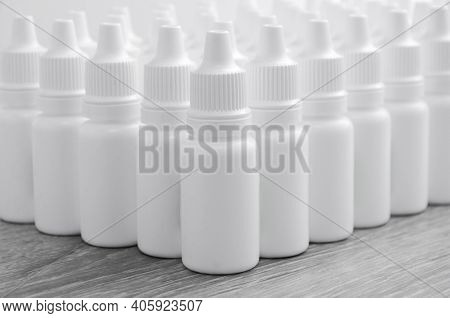 White Bottles. Medical Drops. Packaging For Nal Or Ophthalmic Drops.