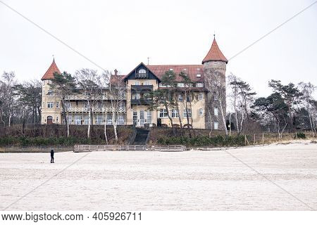 Beautiful Landscape On A Winter Day On The Beach In Łeba In Poland With A Historic Hotel