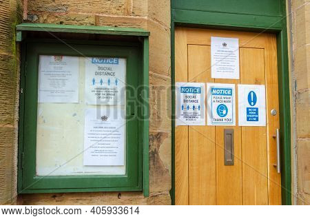 Flint; Uk: Jan 28, 2021: Information Notices And Signs About Social Distancing And The Pandemic At A