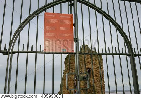 Flint; Uk: Jan 28, 2021: The Entrance Gates To Flint Castle Remain Closed And Locked As Visitors Are