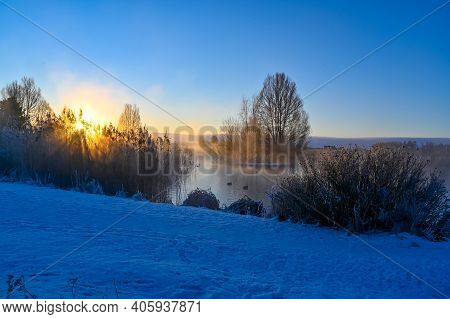 Sunrise And Mist Over Small Pond I Kumla Lakepark Sweden