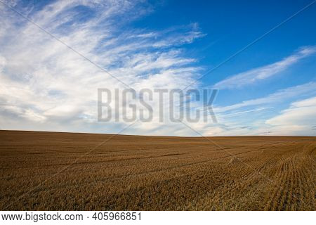 On The Empty Field After Harvesting In Summer Evening. Czech Republic. Amazing Sunset In Czech Bohem