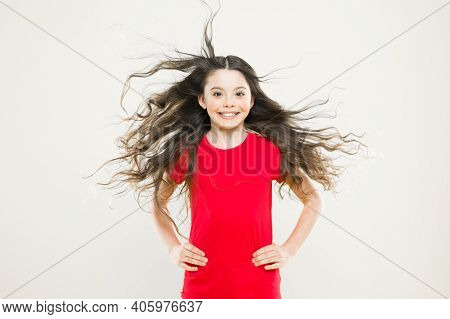 Things You Doing To Damage Your Hair. Girl Adorable Kid Long Wavy Hair Yellow Background. Wind Can A