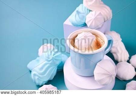 Espresso Cup With Foam. Meringues Of Different Colors On A Blue Background And Coffee. Meringue. A C