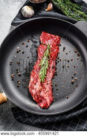 Raw Marbled Beef Steak, Fillet In A Pan With Ingredients For Cooking. Gray Background. Top View