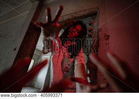 Zombies Are Chasing People In An Abandoned Building On Halloween.