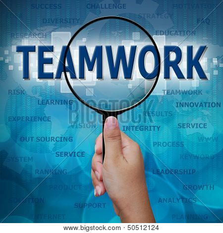 Teamwork In Magnifying Glass On Blue Background