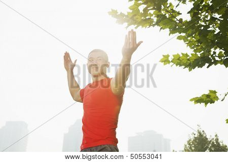 Young Muscular Man Stretching