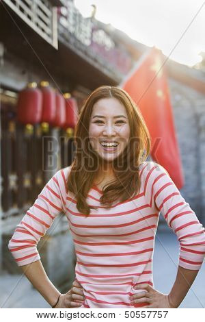 Portrait Of Smiling Young Woman In Houhai, Beijing