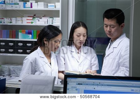 Veterinarias going through paperwork