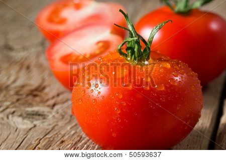 Closeup View Of Tomatoes With Water Drops