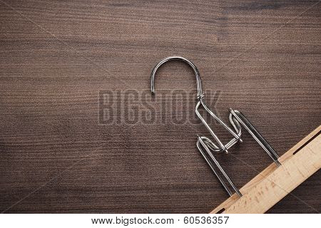 clothing hanger on brown table