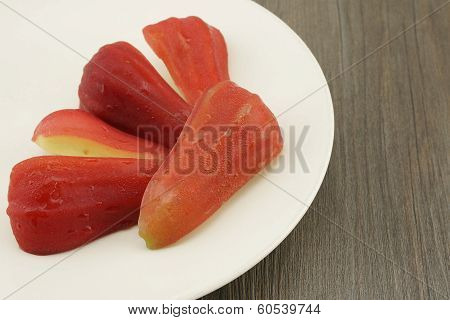 Rose Apple With Dark Brown Wood Background