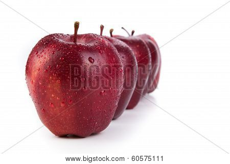 Maroon Apples Lined Up In A Row Closeup