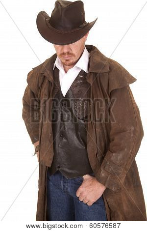 Cowboy In Vest And Duster Hat Cover Eyes Look Down