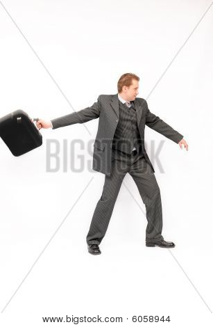 Homme d'affaires, jetant une mallette