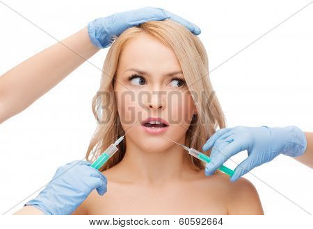 beauty and cosmetic surgery concept - woman face and beautician hands with syringes