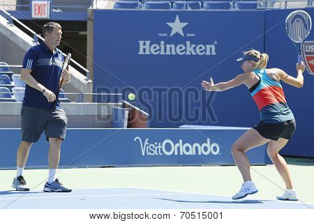 Four times Grand Slam champion Maria Sharapova practices with her coach Sven Groeneveld for US Open