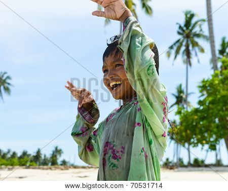 one native child enjoying her dancing on beach