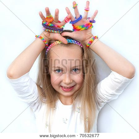 Loom bangs. Little girl demonstrated her craft work