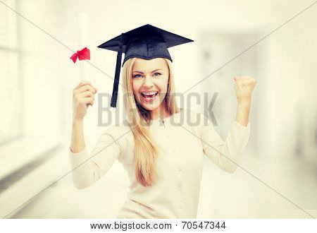 happy student in graduation cap with certificate