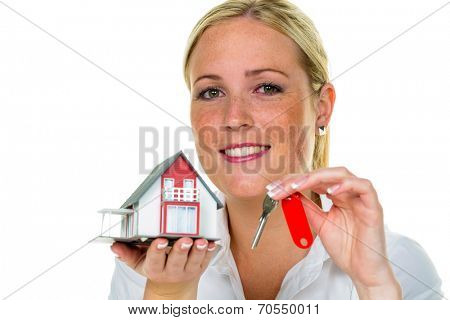 a broker for real estate with a house and a key. successful leasing and home sales by real estate agents.