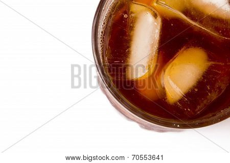 glass with ice tea full with ice cubes