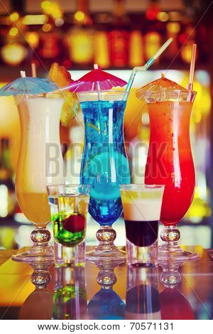 Cocktails Blue Lagoon, Pina Colada And Sunrise