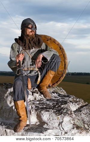 Knight Sitting On A Rock