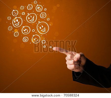 Group of happy hand drawed smiley faces coming out of gun shaped hands