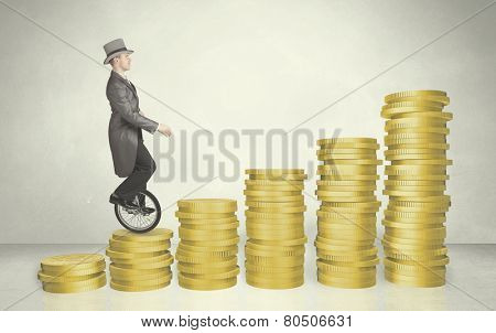 Business man riding monocycle up on coin graph concept on background