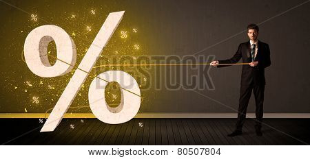 Business man pulling rope with big procent symbol sign concept on background