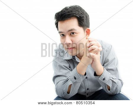 Portriat Of Young Man Sittting On White Background