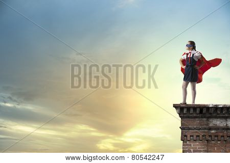Girl of school age in super hero costume