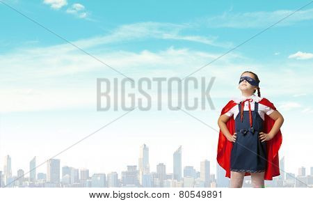Girl of school age in super hero costume