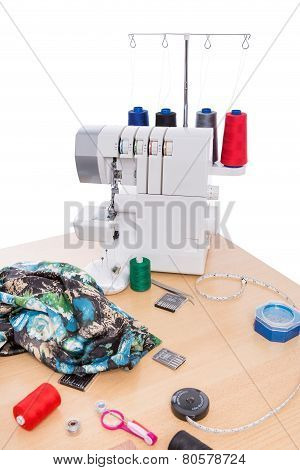 Overlock Sewing Machine On The Table. Sewing Accessories.