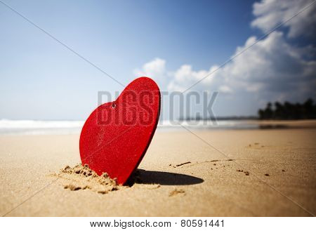 Red heart on exotic sandy beach - Valentine's day concept